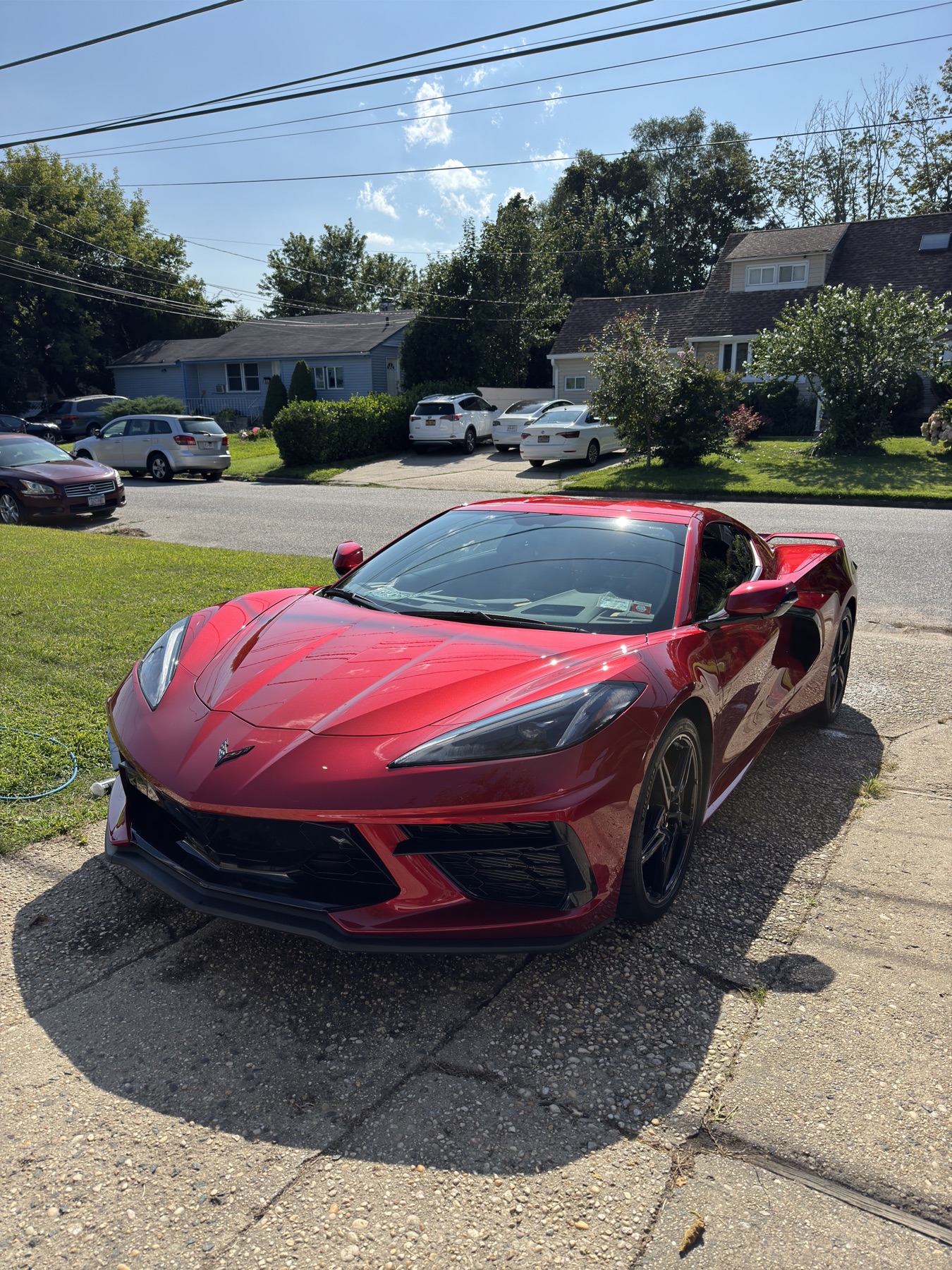 Red Chevrolet Corvette, finished and gleaming in the sun