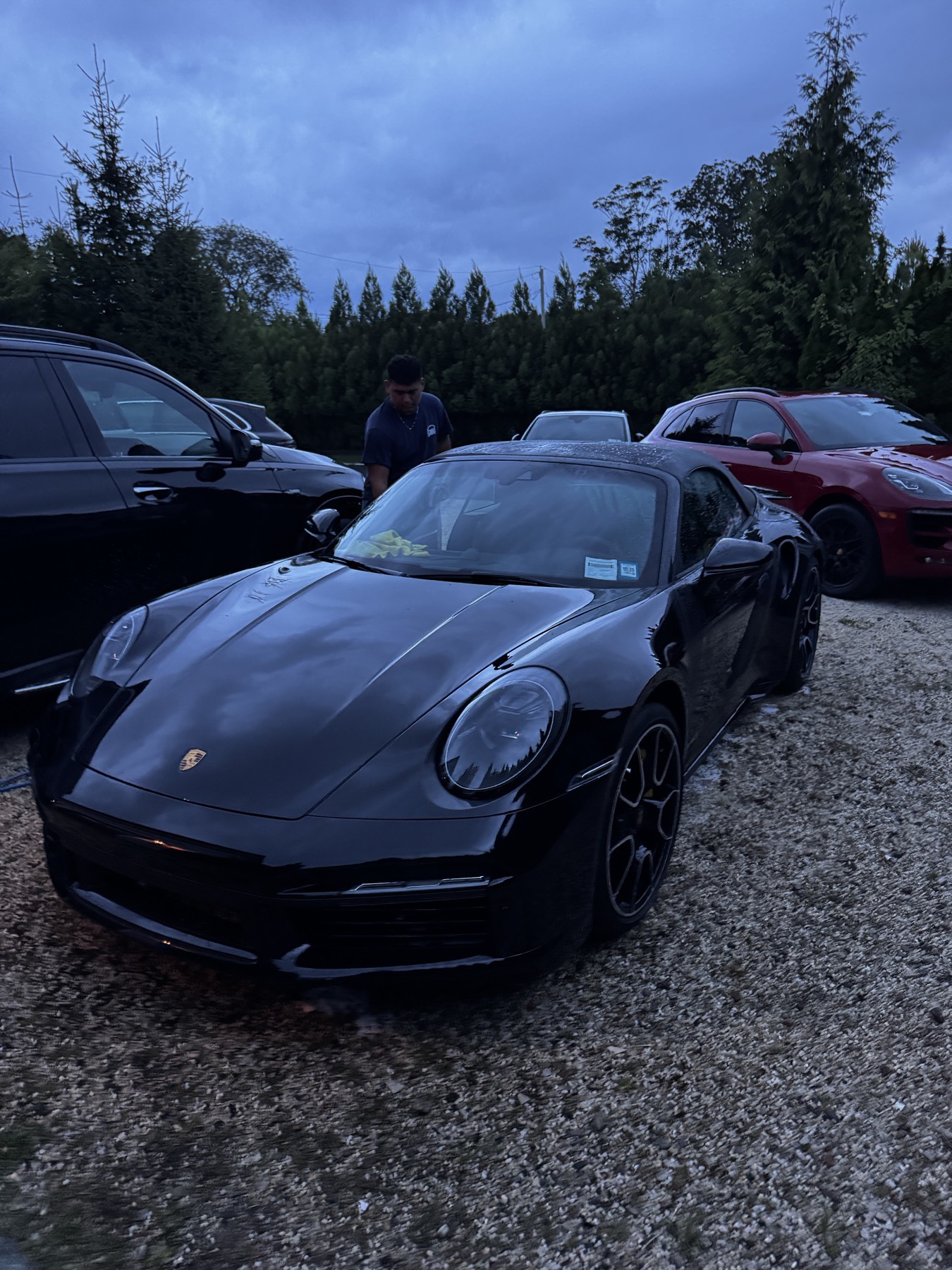 Black Porsche 911 washed down at dusk